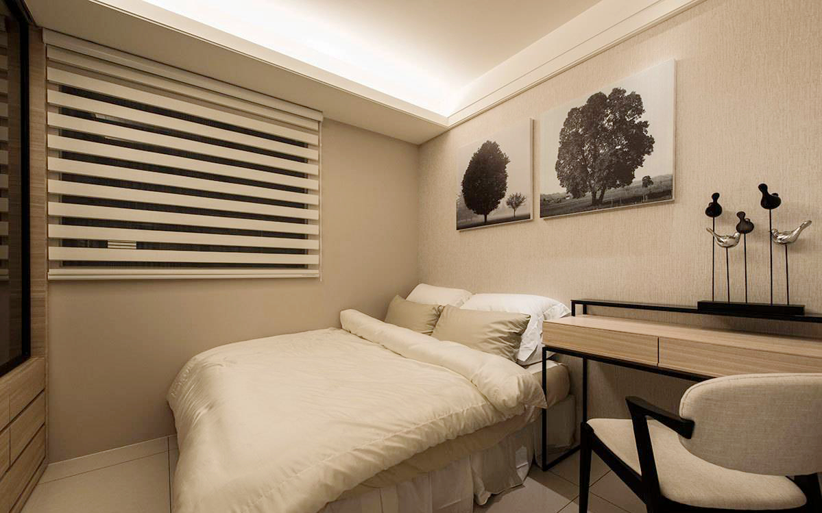 以功能为主的空间设计，透过床头挂画的选搭提升整体质感。