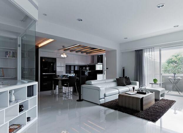 客厅区域以大量的黑与白为主要色调，铺陈出了利落率性的现代质感。