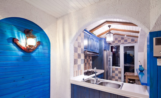 半开放的厨房设计将马赛克瓷砖的精致大方展现了出来。