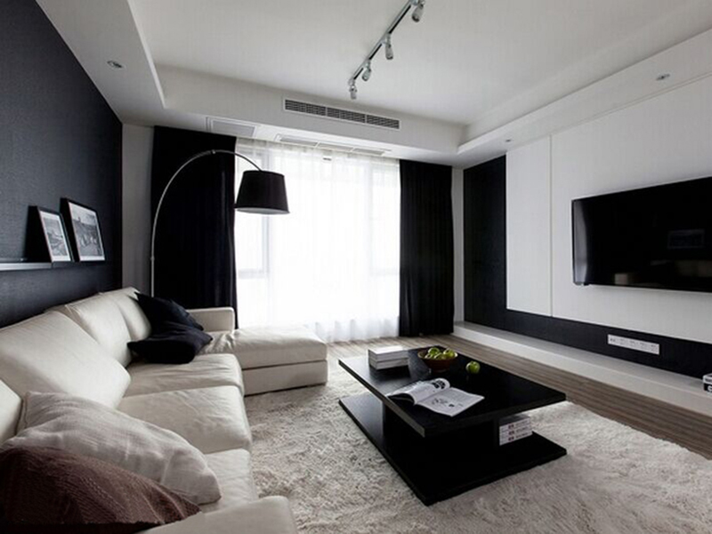 客厅铺上柔软的地毯，黑色对比的经典色下，书写现代的写意家居。