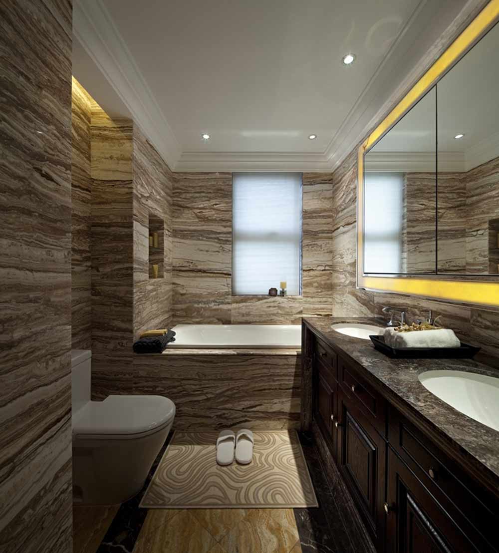 卫生间设计比较简洁，没有繁复的花纹，大理石的墙面清爽易清理。