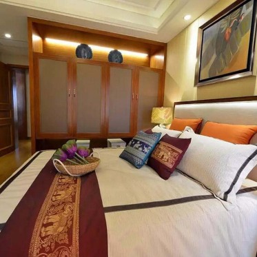 橙色东南亚风格卧室装修效...