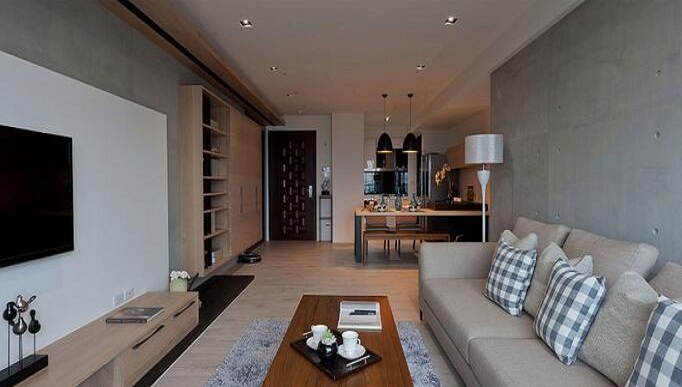 沙发背景墙与电视墙立面在材质上采用清水模，触感简单平实。